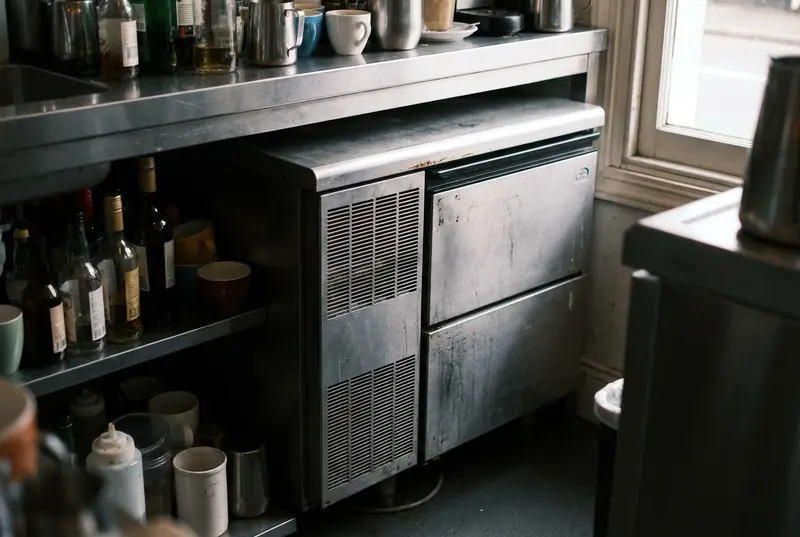 Self-contained undercounter ice maker fitted under a cafe bench